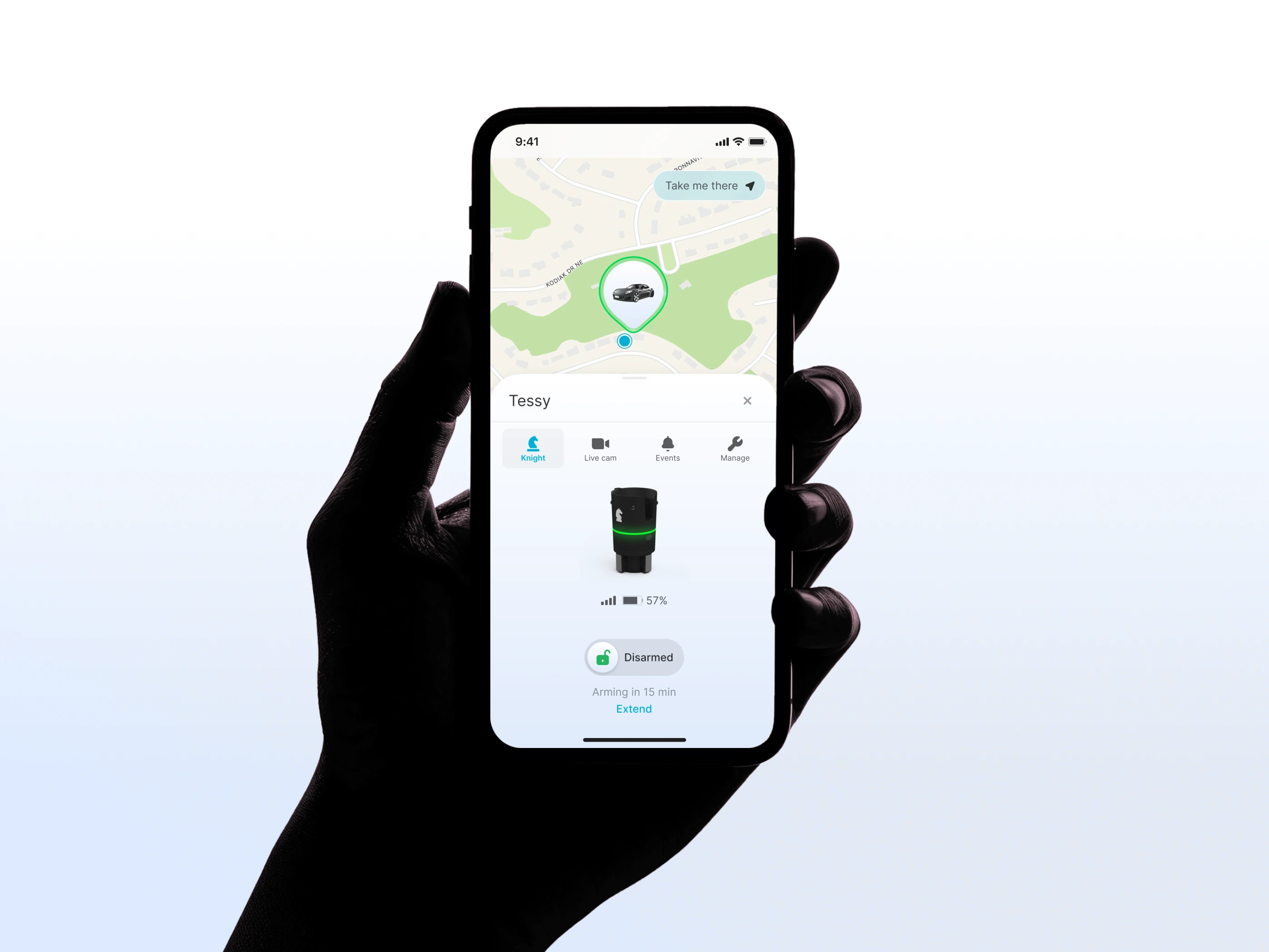 The Keep app held in one hand, showing a car on a map above the Knight device, its battery at 57 percent and a disarmed state