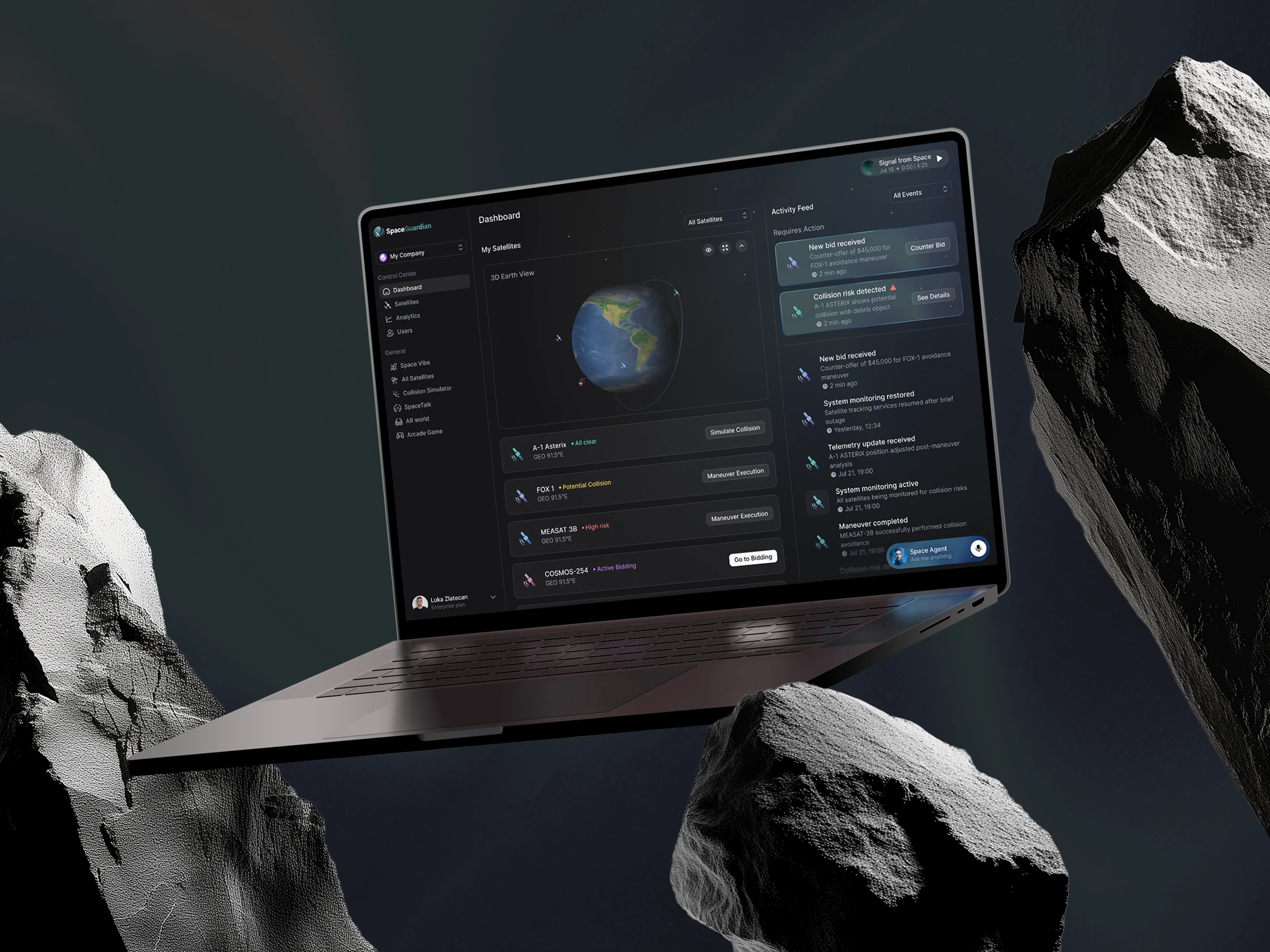 The Space Guardian dashboard on a laptop floating between two asteroids, showing the tracked satellite list beside an activity feed